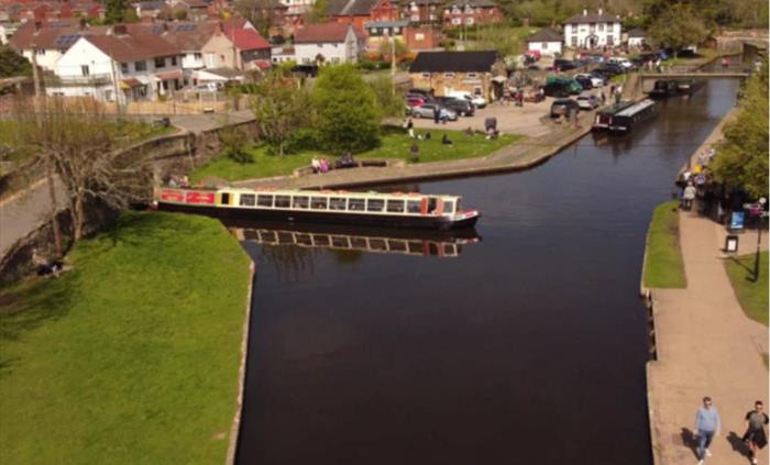 In this scene, Llangollen Wharf's Motorised Canal Boat Thomas Telford has arrived at Trevor Basin and is preparing to turn to cross the Poncysyllte Aq